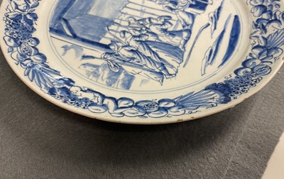A pair of Dutch Delft blue and white plates with biblical scenes, 18th C.